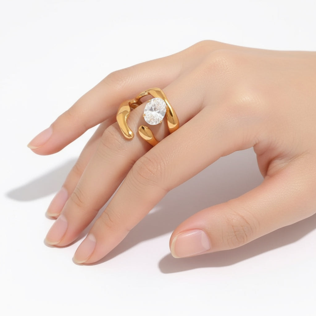 Gold ring with a diamond on a white background